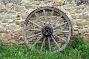Wooden wagon wheel illustrating the circular roots of the word cyclone